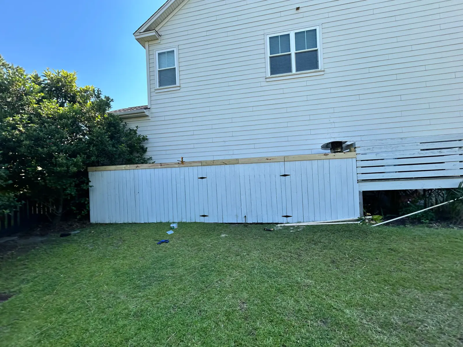 Completed fence section following the property edge
